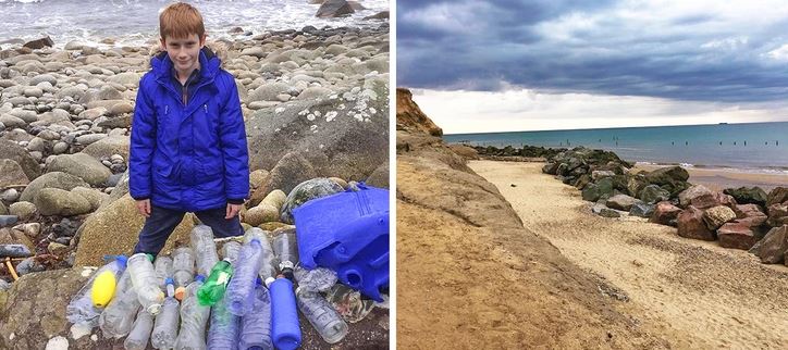 Chlapec v modrom kabáte zbiera plastový odpad na skalnatej pláži pri mori.