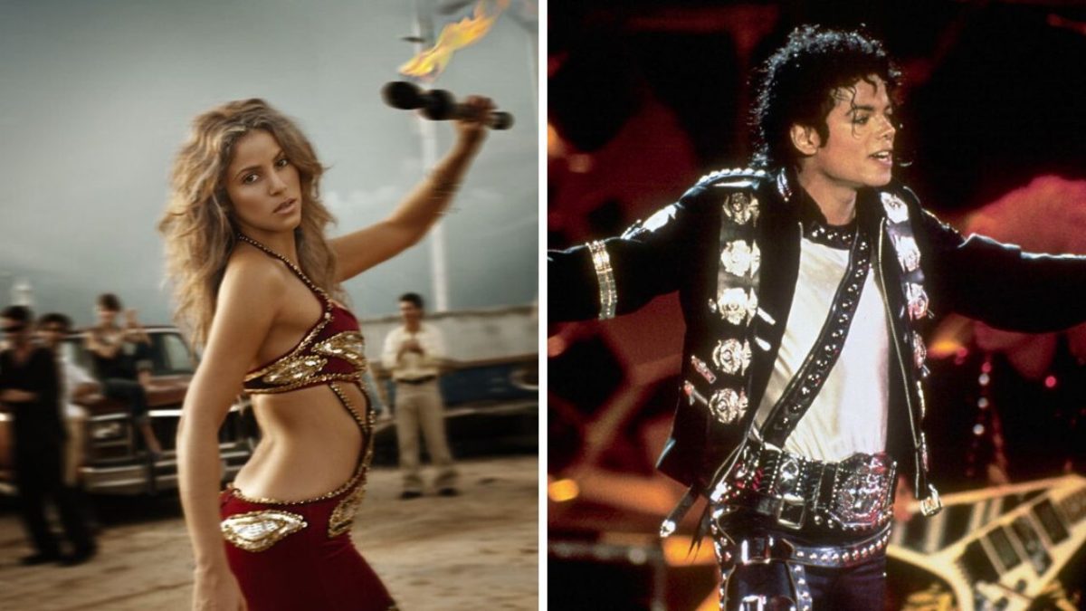 Oslňujúci tanečník s ohňom v exteriéri a spevák na pódiu počas koncertu.