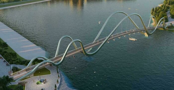 Futuristický most cez rieku s vlnitým dizajnom, spájajúci oba brehy a ponúkajúci unikátne architektonické riešenie.