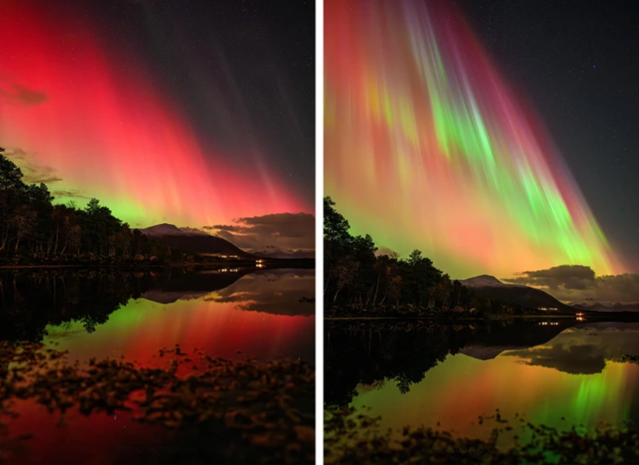 Polárna žiara s červenými a zelenými odtieňmi odrážajúca sa na hladine jazera, obklopená horami a stromami.