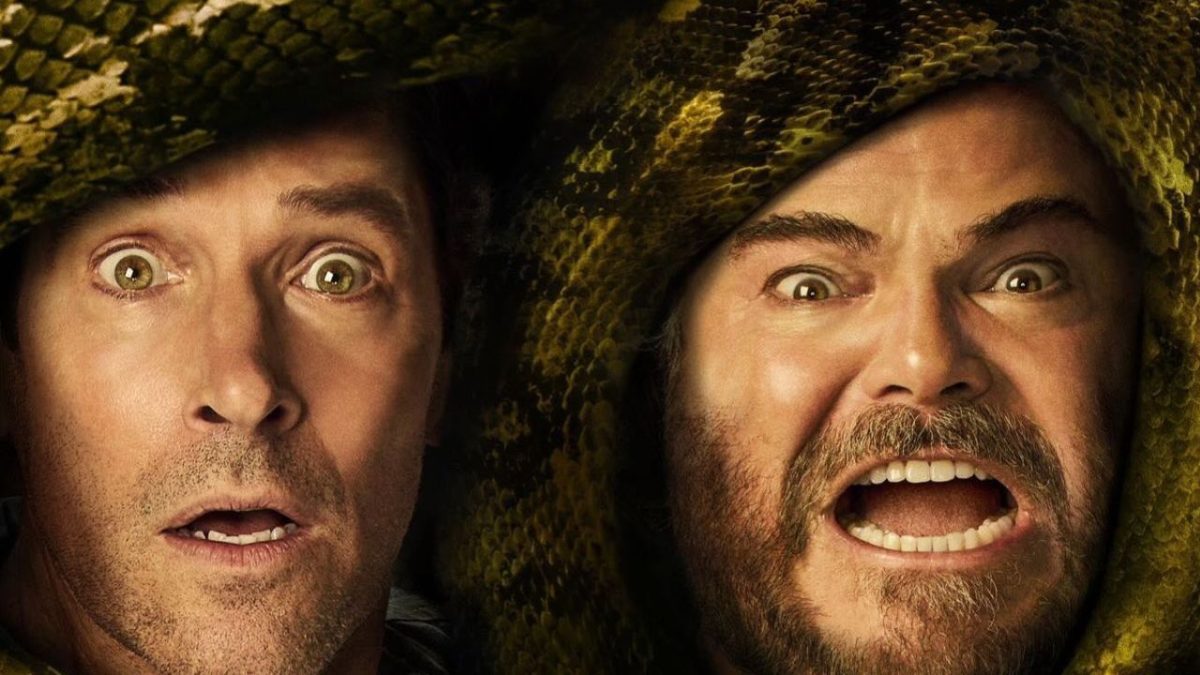 Dva vystrašené tváre s hadom omotaným okolo hláv, výraz strachu a prekvapenia.