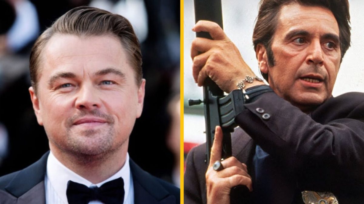 Osoba v obleku na červenom koberci, vedľa nej postava s puškou v akčnej póze.