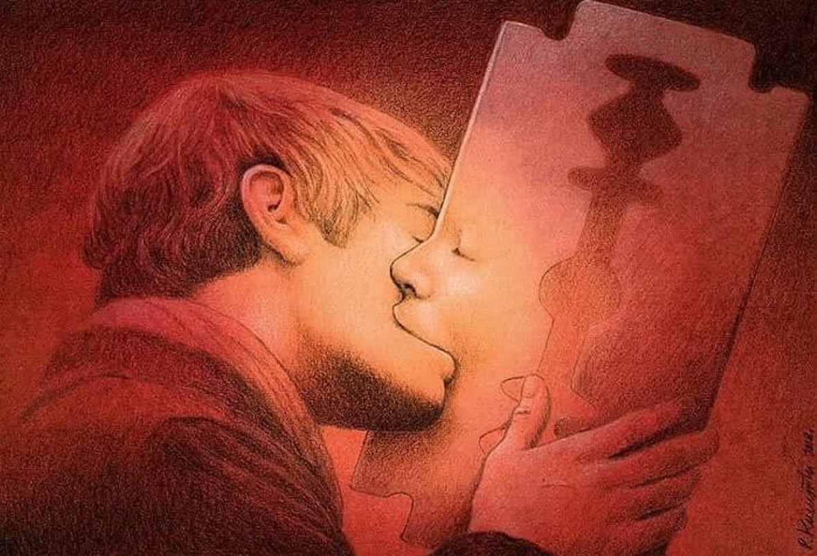 Muž drží žiletku v tvare bozkávajúcej sa tváre, symbolizujúcu bolestivú lásku.