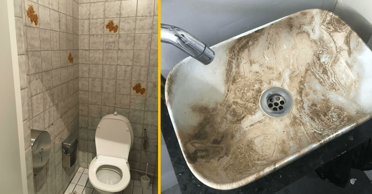 Verejné WC s bielym záchodom a umývadlom s usadeninami.