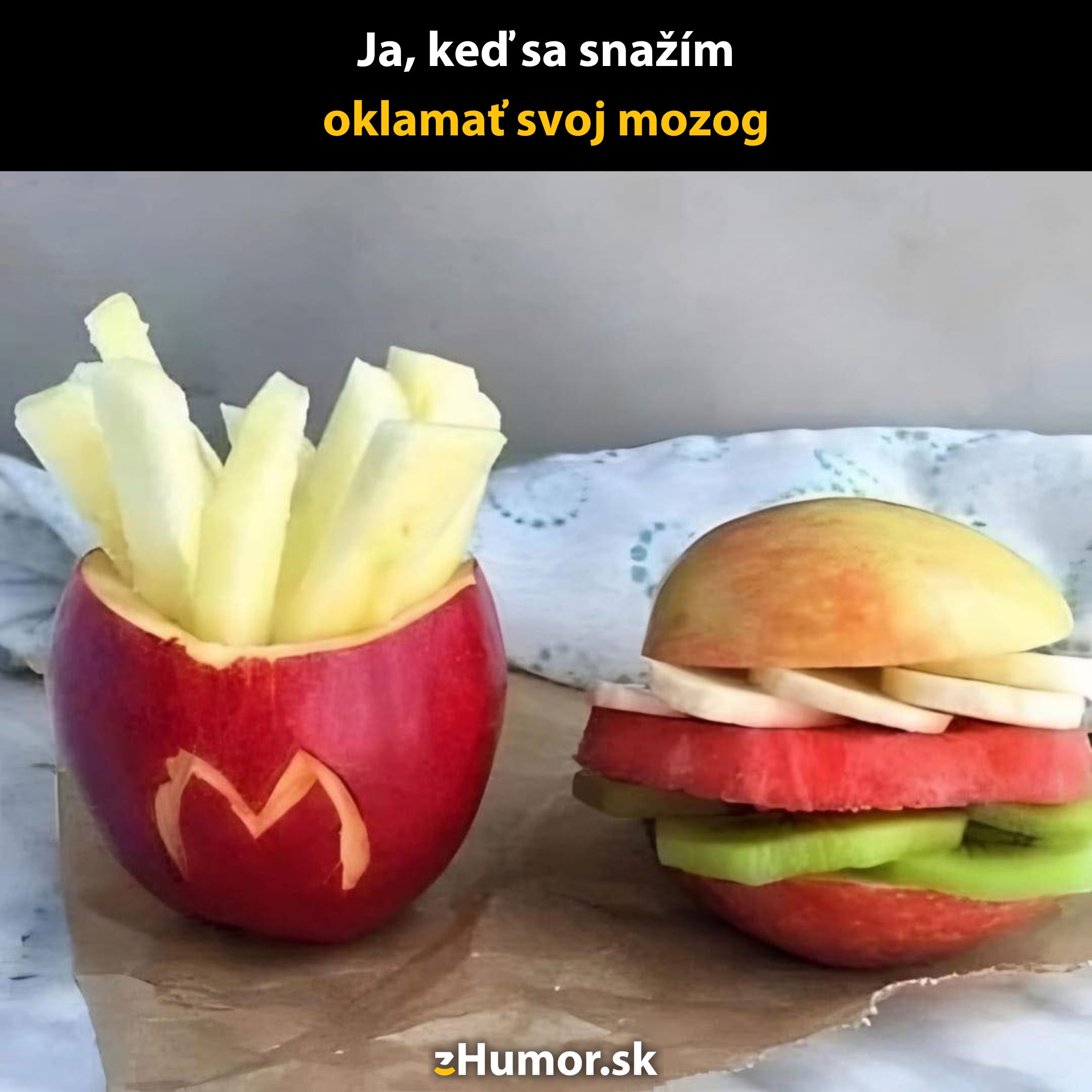 Zdravý fast food z ovocia so šalátom a hranolkami vo vyrezanom jablku, paródia na jedlo v štýle reštaurácie.