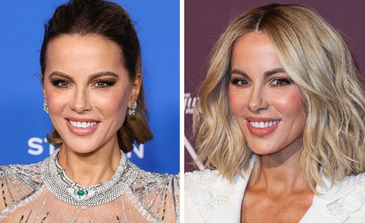 Osoba na obrázku s tmavými a blond vlasmi na červenom koberci, dekoratívne náušnice, elegantné outfity.