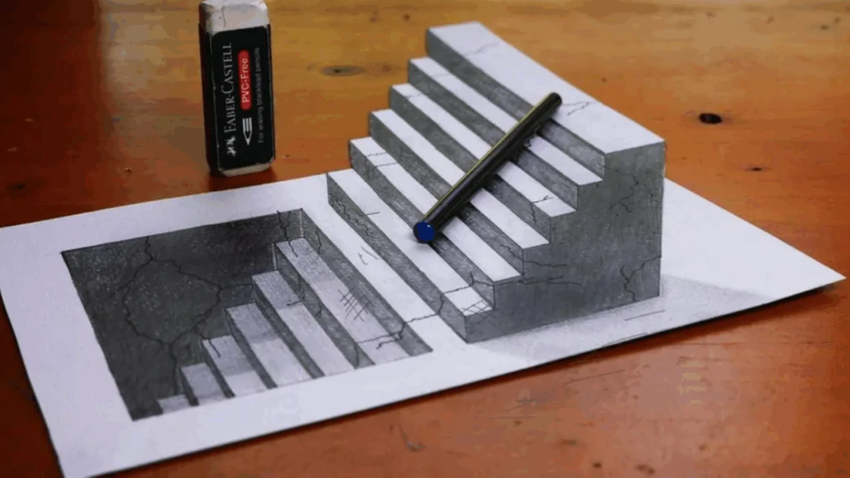 Optická ilúzia schodov nakreslená na papieri s ceruzkou a gumou na drevenom stole.