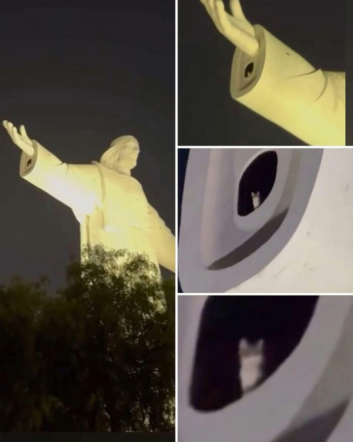 Socha s rozpaženými rukami v noci, detail otvoru s mačkou.