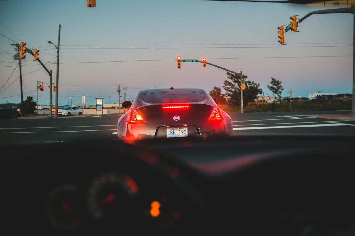 red car on road during daytime