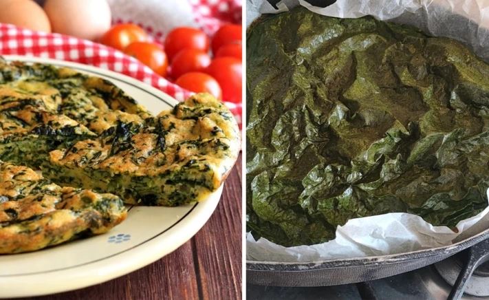 Špenátová omeleta s čerstvými paradajkami na drevenom stole vedľa listov špenátu na pečacom papieri.