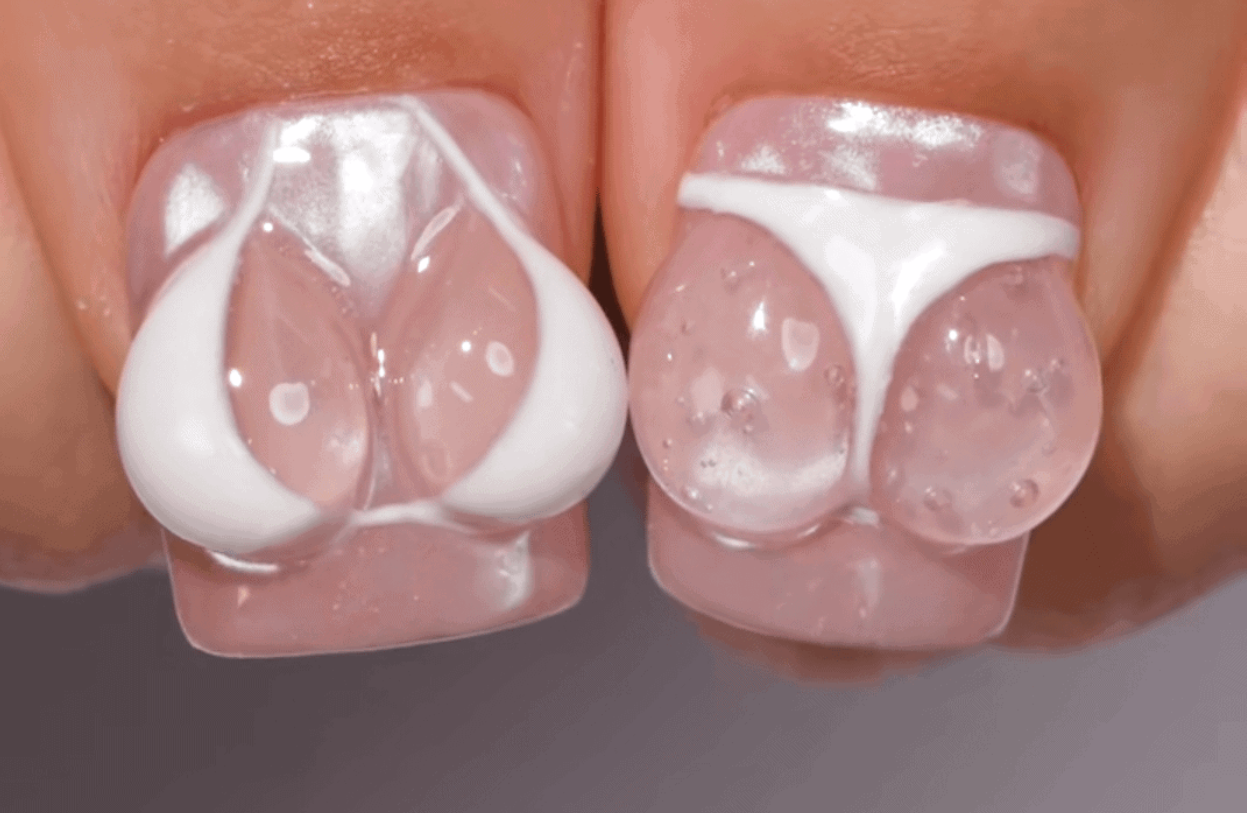 Nail art s 3D dizajnom v tvare plaviek na nechtoch, kreatívny a jedinečný štýl pre letné obdobie.