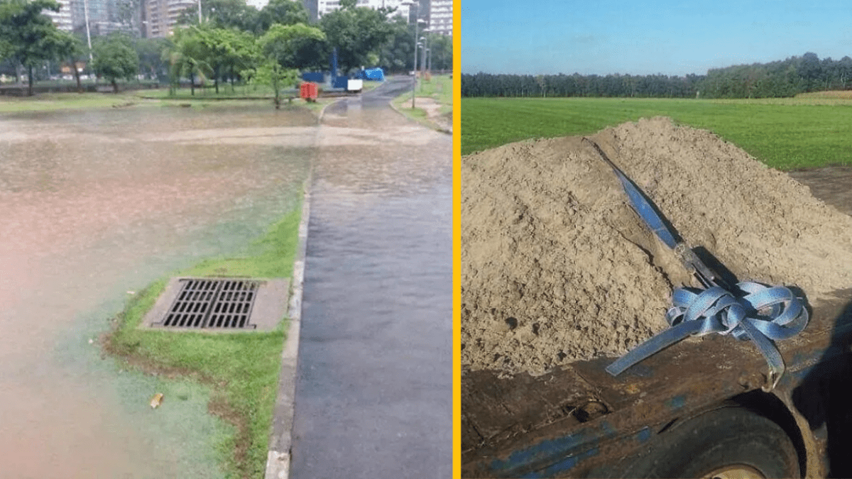 Zaplavený chodník v meste vedľa improvizovaného prepravného riešenia s pieskom na poli.