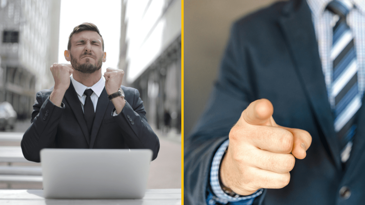 Muž v obleku s laptopom oslavuje úspech; detail ruky ukazuje prstom, gesto sebavedomia.