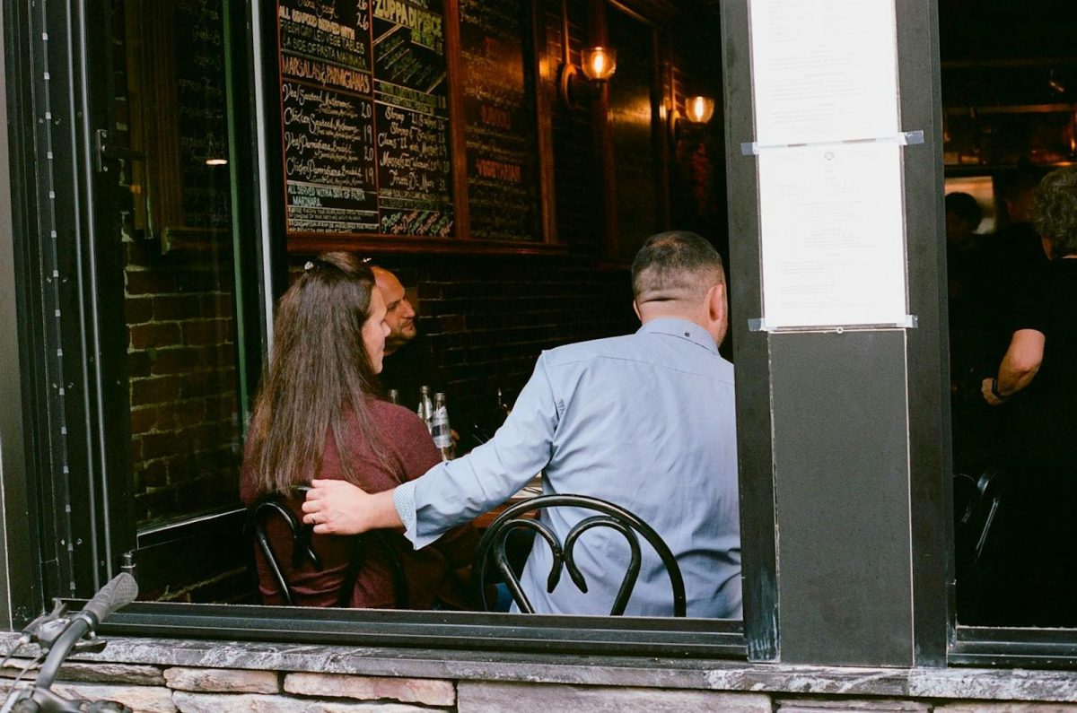 A man and a woman sitting at a table in a restaurant