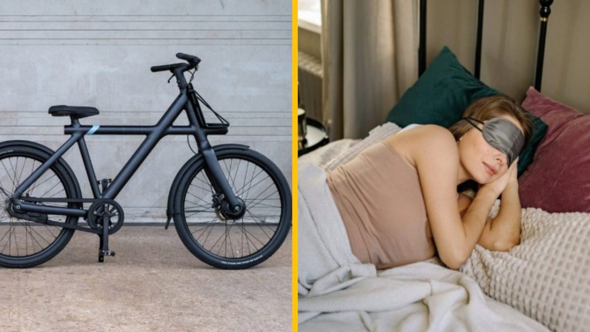 Čierny bicykel pri stene a žena spiaca v posteli s páskou na očiach.