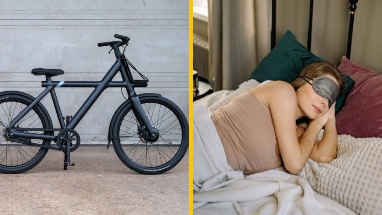 Čierny bicykel pri stene a žena spiaca v posteli s páskou na očiach.