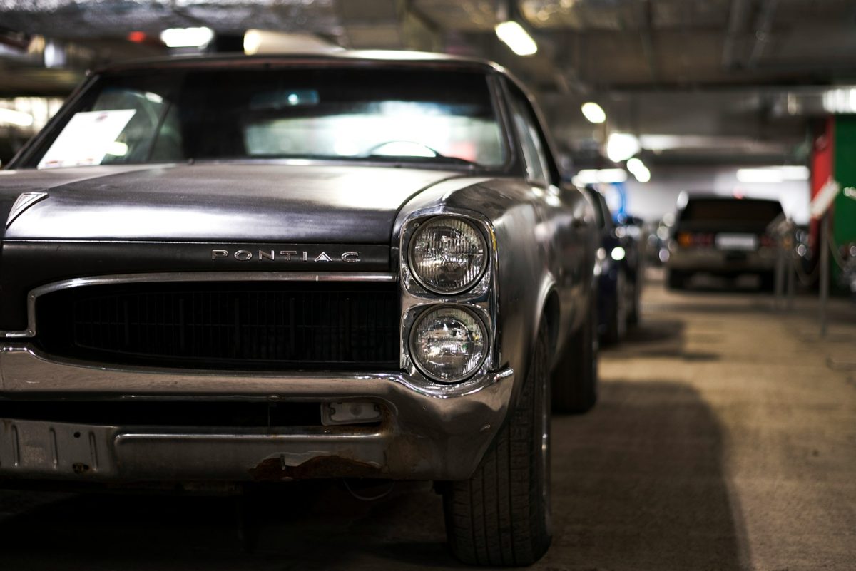 a black car parked in a parking garage