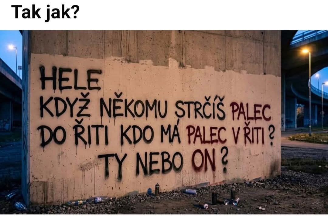 Graffiti na betónovej stene pod mostom s nápisom v češtine a sprejmi na zemi.