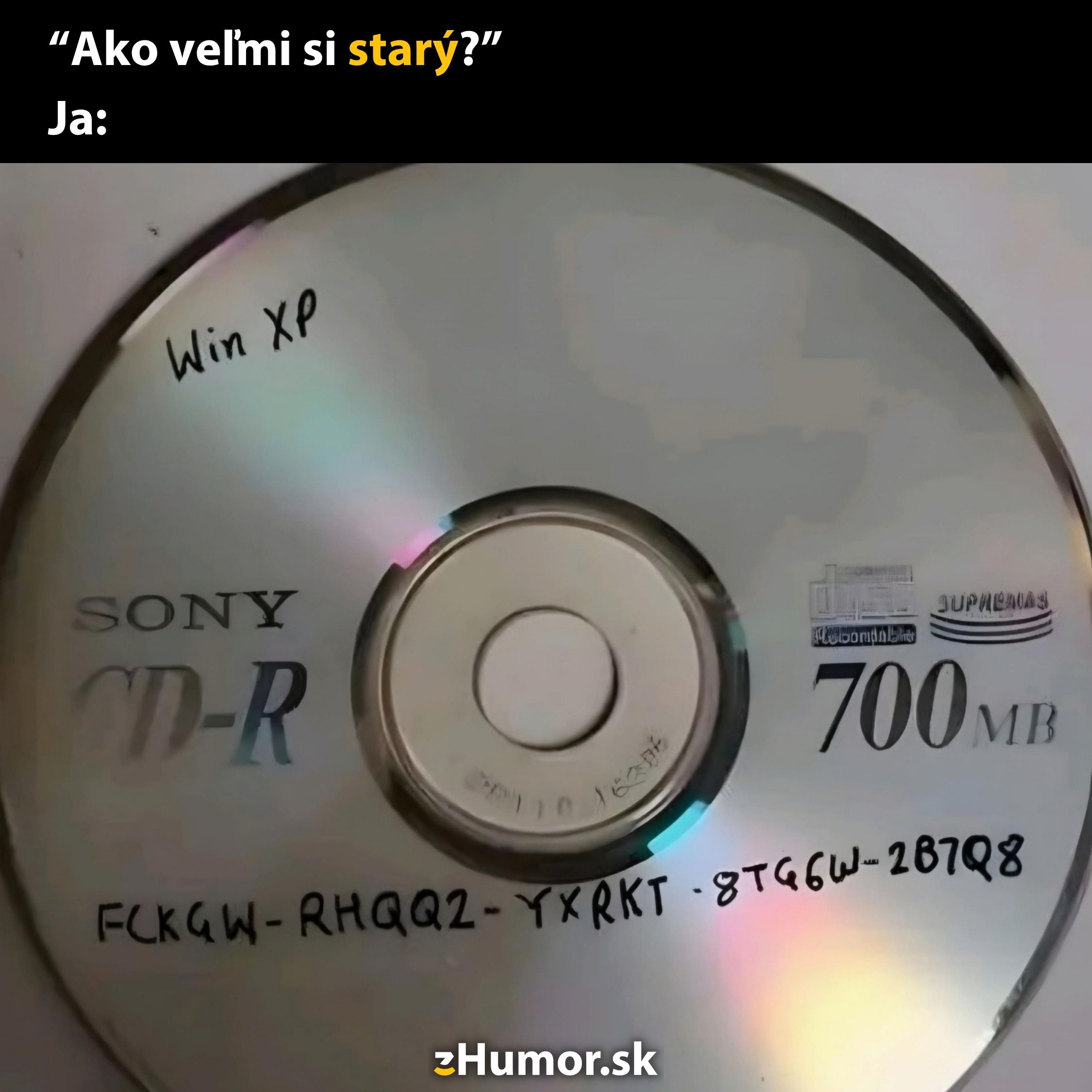 CD-R s popisom Win XP a licenčným kľúčom, vtip na tému technologického veku.