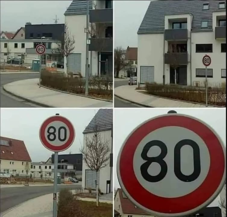 Cestná značka s maximálnou rýchlosťou 80 km/h v obytnej zóne, ktorá vyvoláva úsmevný kontrast s prostredím.
