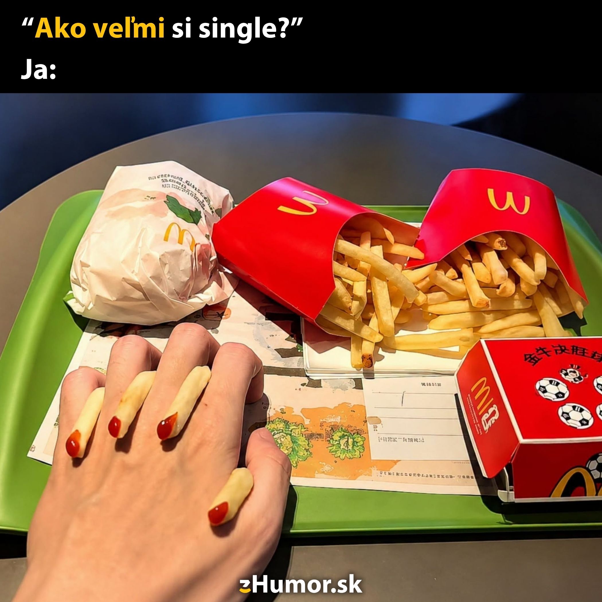 Osoba s vyprážanými hranolkami ako nechty na tácke z fast foodu. Text: Ako veľmi si single? Ja.
