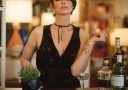 a woman sitting at a bar